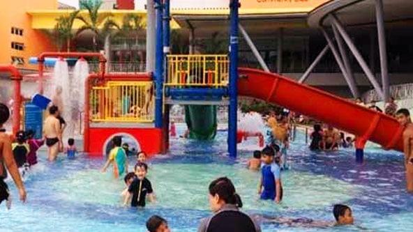 kids playing a swimming pool