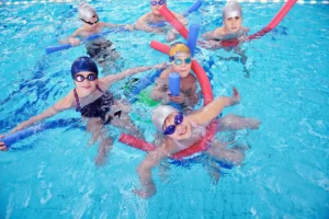 medium happy children group at swimming pool