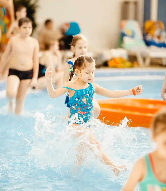 Children Playing In A Swimming Pool